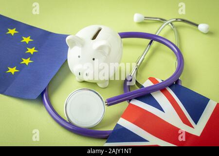 Piggy bank and stethoscope with flags Stock Photo
