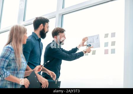 successful boss is discussing with the staff of financial performance Stock Photo