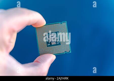 Hand holding CPU.  desktop CPU,  processoor. Informatic chip, PC component. Micro chip. Stock Photo
