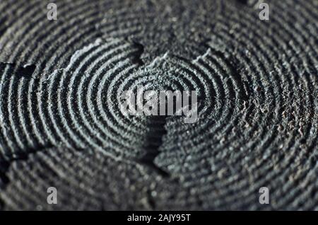 Macro of old and damaged metal heating element from electric range. Surface layers peeling away Stock Photo