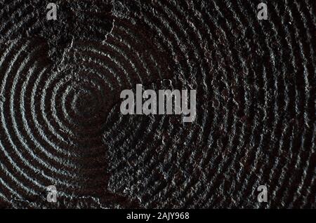 Macro of old and damaged metal heating element from electric range. Surface layers peeling away Stock Photo
