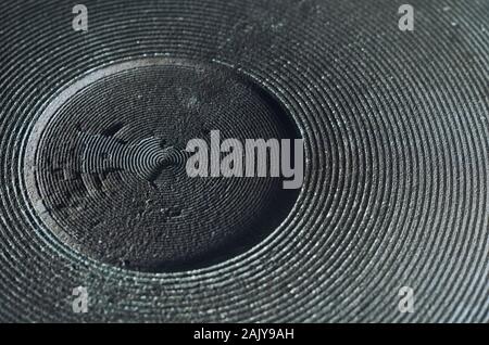 Macro of old and damaged metal heating element from electric range. Surface layers peeling away Stock Photo