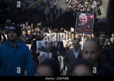 Tehran, Iran. 6th Jan, 2020. Iranians attend the funeral ceremony of slain Iranian Revolutionary Guards Corps (IRGC) Lieutenant general and commander of the Quds Force Qasem Soleimani and of other victims in Tehran, Iran. Soleimani was killed in a targeted US airstrike on 03 January 2020 in Baghdad, Iraq. The processions mark the first time Iran honored a single man with a multi-city ceremony. Not even Ayatollah Ruhollah Khomeini, who founded the Islamic Republic, received such a processional with his death in 1989. Credit: Rouzbeh Fouladi/ZUMA Wire/Alamy Live News Stock Photo