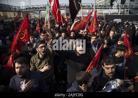 Tehran, Iran. 6th Jan, 2020. Iranians attend the funeral ceremony of slain Iranian Revolutionary Guards Corps (IRGC) Lieutenant general and commander of the Quds Force Qasem Soleimani and of other victims in Tehran, Iran. Soleimani was killed in a targeted US airstrike on 03 January 2020 in Baghdad, Iraq. The processions mark the first time Iran honored a single man with a multi-city ceremony. Not even Ayatollah Ruhollah Khomeini, who founded the Islamic Republic, received such a processional with his death in 1989. Credit: Rouzbeh Fouladi/ZUMA Wire/Alamy Live News Stock Photo