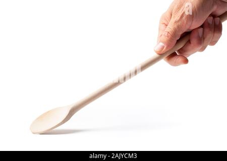 Human hand with a wooden cooking spoon with working path isolated on white background Stock Photo
