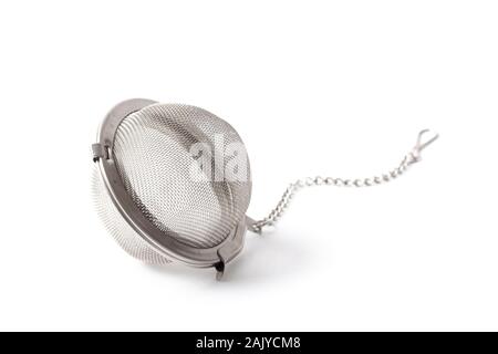 Empty metallic tea strainer infuser isolated on white background Stock Photo