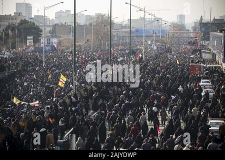 Tehran, Iran. 6th Jan, 2020. Iranians attend the funeral ceremony of slain Iranian Revolutionary Guards Corps (IRGC) Lieutenant general and commander of the Quds Force Qasem Soleimani and of other victims in Tehran, Iran. Soleimani was killed in a targeted US airstrike on 03 January 2020 in Baghdad, Iraq. The processions mark the first time Iran honored a single man with a multi-city ceremony. Not even Ayatollah Ruhollah Khomeini, who founded the Islamic Republic, received such a processional with his death in 1989. Credit: Rouzbeh Fouladi/ZUMA Wire/Alamy Live News Stock Photo