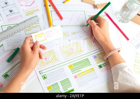 The designer develops web applications for mobile phones. Sketch user interface for smartphones. Stock Photo