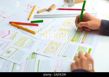 The designer develops web applications for mobile phones. Sketch user interface for smartphones. Stock Photo