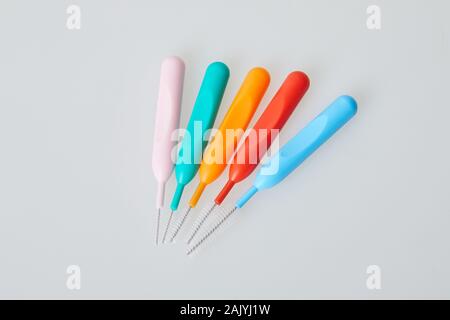 Brushes for braces, toothbrushes for interdental spaces on white background. Close up. Macro. The concept of good mouth hygiene. Different sizes of in Stock Photo