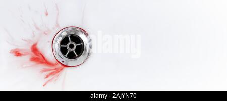 Blood and spit splatter drains in a white sink. Panoramic image with copy space. Stock Photo