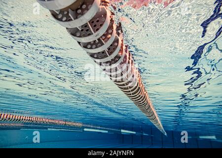 Olympic Swimming pool underwater background. Stock Photo