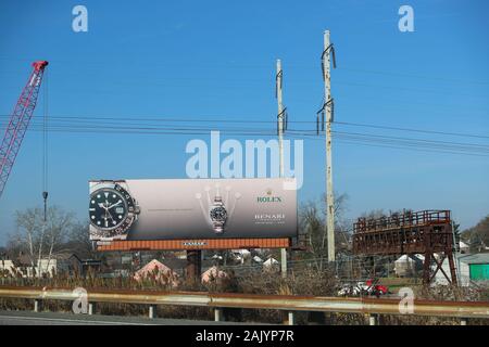 PRINCETON, NJ - December 26, 2019:A billboard advertising the Rolex logo which on the highway. Rolex is a Swiss luxury watchmaker - Image Stock Photo