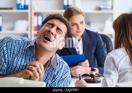 The young family filing divorce papers with lawyer Stock Photo