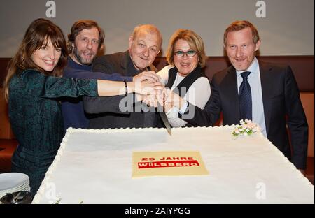 06 January 2020, Hamburg: Ina Paule Klink (l-r), Oliver Korittke, Leonard Lansink, Rita Russek and Roland Jankowsky, all actors, attend the reception on the occasion of the anniversary '25 years Wilsberg' and cut the cake. Photo: Georg Wendt/dpa Stock Photo