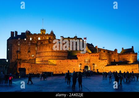 Edinburgh Castle floodlit at dusk in winter, Scotland, UK Stock Photo
