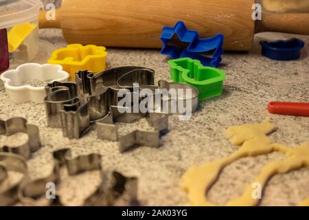 dough and cookie cutter with a kitchen roll an flour for baking cookies for christmas Stock Photo