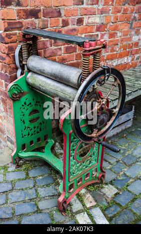 An old fashioned mangle at the rear of a house in the Preston Park museum,Stockton on Tees,England,UK Stock Photo