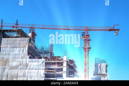 Workers are working on construction sites  in the structural steel beam build large residential buildings. Stock Photo