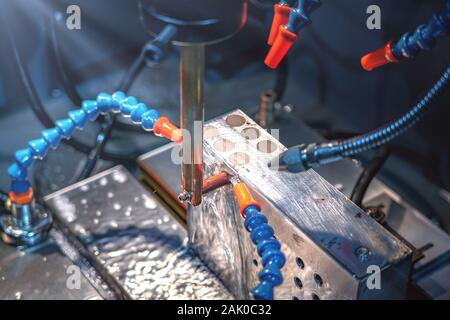 CNC machine cutting metal parts by water jet pressure Stock Photo