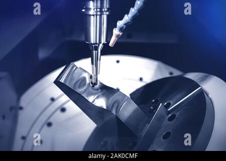 High precision CNC milling machine cutting process for forming metal parts using blades Stock Photo