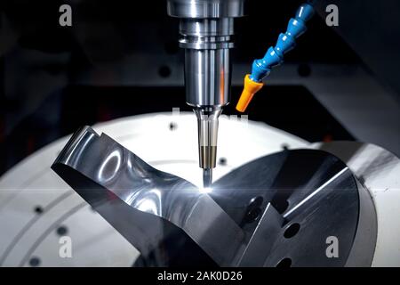 High precision CNC milling machine cutting process for forming metal parts using blades Stock Photo