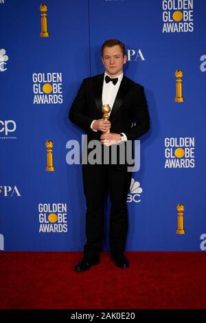 Actor Taron Egerton in the press room after winning the award for Best ...