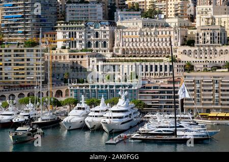 Apartment buildings, luxury yachts and sailing boats in Port Hercules harbour, La Condamine, Principality of Monaco, French Riviera, Europe Stock Photo