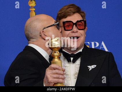Beverly Hills, United States. 06th Jan, 2020. Bernie Taupin (L) and Elton John appear backstage after winning the award for winners for the award for Best Original Song - Motion Picture for 'I'm Gonna Love Me Again' from 'Rocketman' during the 77th annual Golden Globe Awards, honoring the best in film and American television of 2020 at the Beverly Hilton Hotel in Beverly Hills, California on Sunday, January 5, 2020. Photo by Jim Ruymen/UPI Credit: UPI/Alamy Live News Stock Photo