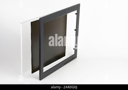 Three part of LCD monitor, firtst  plastic frame,   the second  panel consists of polarizing filters, glass and  liquid-crystal display, third 6 mm or Stock Photo