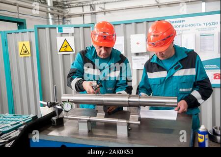 Technicians working in factory Stock Photo
