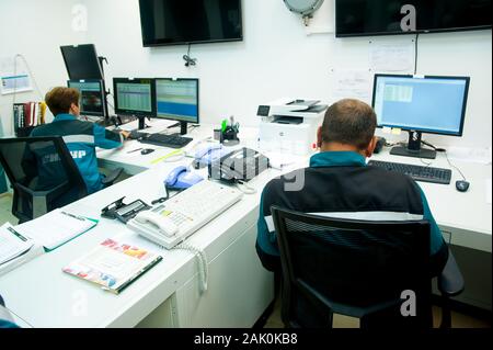 Workers in control room of polypropylene factory Stock Photo