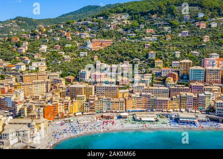Aerial view of Camogli. Colorful buildings near the ligurian sea. View from above on the public beach with azure and clean water. Stock Photo