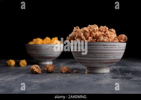 A close up of caramel popcorn in a bowl taken in the studio. Stock Photo