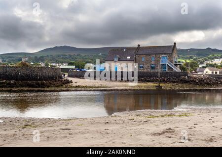 Looking over the Nevern estuary, past the boating club house at Parrog from Newport sands towards Mynydd Carningli Stock Photo