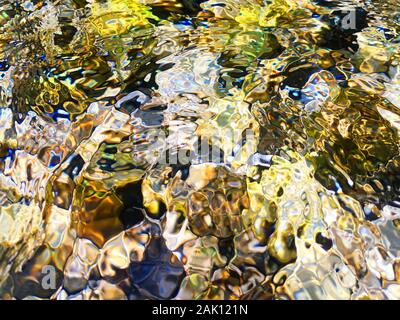 Multi-colored river stones.Background of colored sea stones close-up. Stock Photo