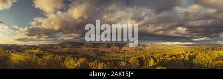 Autumn landscape at sunset - mountains and beautiful clouds, hills of Bohemian Switzerland and Saxon Switzerland National Park, Czechia and Germany Stock Photo