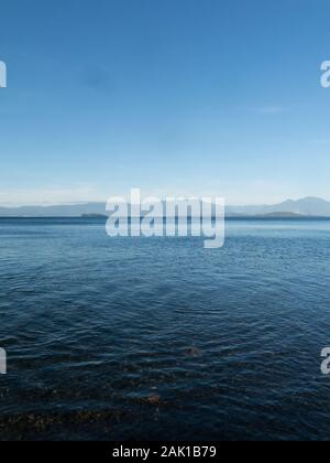 Panoramic of Lake Ranco, the third largest lake in Chile. In the region of Los Ríos, in Araucanía or Patagonia, Chilean Andes. South of Chile. In the Stock Photo