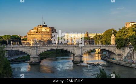 Beautiful view on river Tiber and Castel Saint Angelo in Rome. Homeless people camp under bridge - Rome, eternal city, Italy Stock Photo