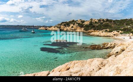 Transparent turquoise water in best beaches of Sardinia, Italy - Cala Napoletana. Beaches of Caprera Island in The Maddalena Archipelago. Stock Photo