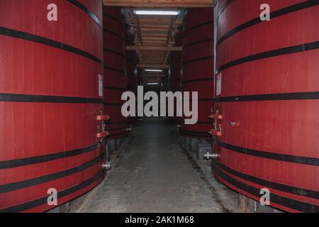 Corridor with several tanks for storage and wine aging at the Aurora Winery in Bento Goncalves. A wine producing country city in southern Brazil. Stock Photo