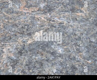 Gray marble polished surface of natural stone close-up. Background. Stock Photo