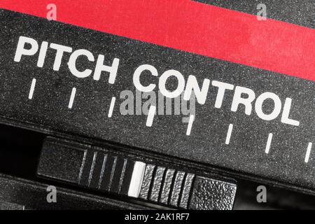Macro close up view of vintage pitch control tape machine speed slider. Stock Photo