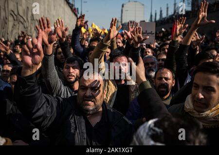 Tehran, Iran. 6th Jan, 2020. People mourn during the funeral ceremony of Iranian general Qassem Soleimani in Tehran, Iran, Jan. 6, 2020. Hundreds of thousands of Iranians in Tehran on Monday mourned the assassination of Qassem Soleimani. Credit: Ahmad Halabisaz/Xinhua/Alamy Live News Stock Photo