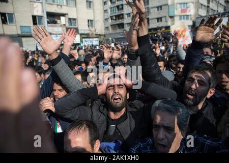 Tehran, Iran. 6th Jan, 2020. People mourn during the funeral ceremony of Iranian general Qassem Soleimani in Tehran, Iran, Jan. 6, 2020. Hundreds of thousands of Iranians in Tehran on Monday mourned the assassination of Qassem Soleimani. Credit: Ahmad Halabisaz/Xinhua/Alamy Live News Stock Photo