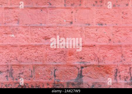 Concrete block wall painted red color of background and texture. Stock Photo