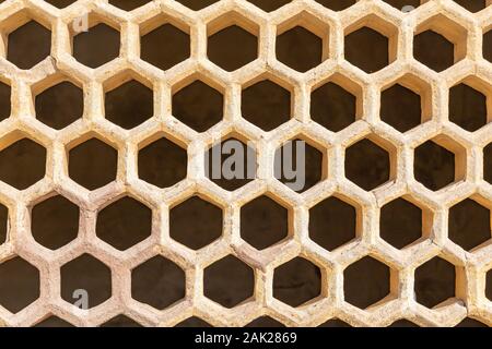Yellow color ventilated bricks wall background and texture. Stock Photo