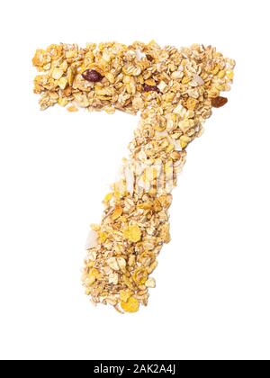 Arabic numeral '7'   from muesli with coconut, berries, raisins, cereal and natural cereals  on a white isolated background. Food pattern made from gr Stock Photo