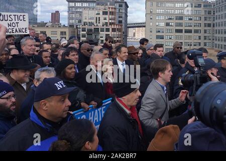 NEW YORK, NY - JANUARY 05: Letitia James, Kirsten Gillibrand, Bill De Blasio, Chuck Schumer, and Andrew Cuomo march across the Brooklyn Bridge at the Stock Photo