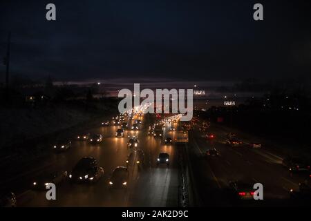 Double exposure of cars driving on an interstate highway at night Stock Photo